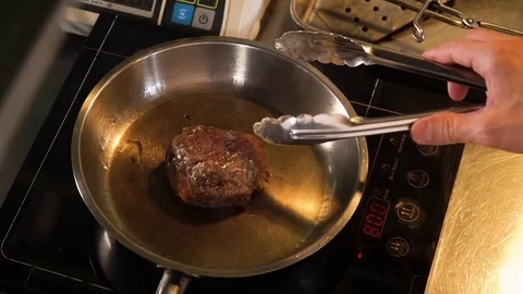 Steaks are cooked in a skillet Stockbeeldmateriaal 82286427