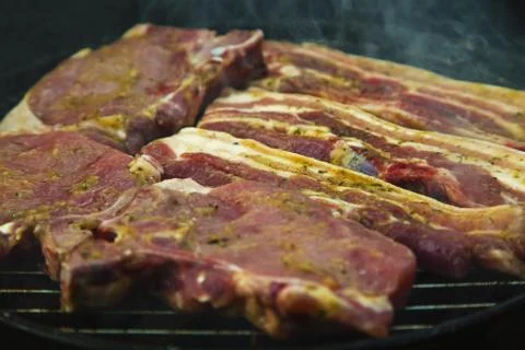 Steaks on barbecue Stock Photos