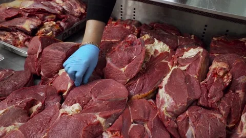 Steaks of fresh raw beef meat ready to be grilled at the market. The seller 스톡 동영상 197014195