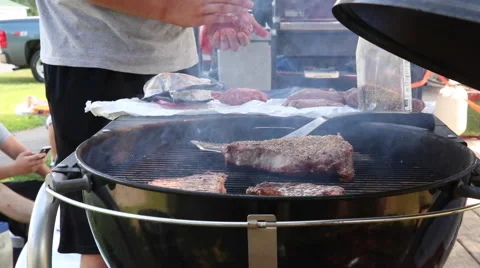 Steaks on a grill Stockbeeldmateriaal 45699377