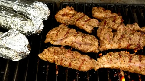 Steaks on the grill Stock Footage 77490013