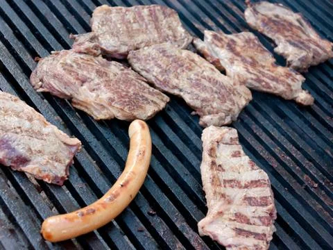 Steaks on the grill Stock Photos