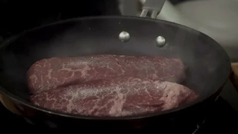 Steaks on a pan Stock Footage 79507362
