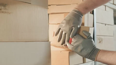 Stealing parcels and damaging the packaging of goods in the warehouse. Stealing  스톡 동영상 160551438