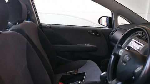 Stealing a tablet and wallet in a car Stock Footage 35659483