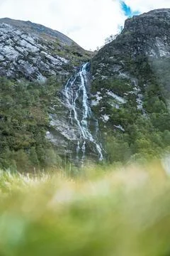 The Steall Falls waterfall cascading down a rugged mountain in Glen Nevis Stock Photos