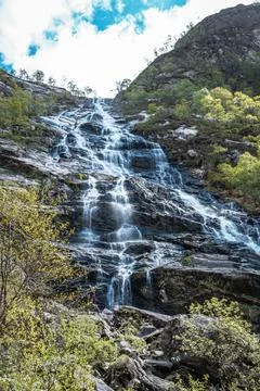 The Steall Falls waterfall cascading down a rugged mountain in Glen Nevis Stock Photos