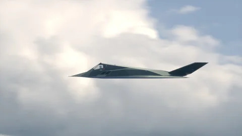 Stealth Attack Aircraft Flying In The Sky. Stockbeeldmateriaal 333115701
