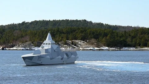 Stealth corvette in archipelago Stock Footage 87391015
