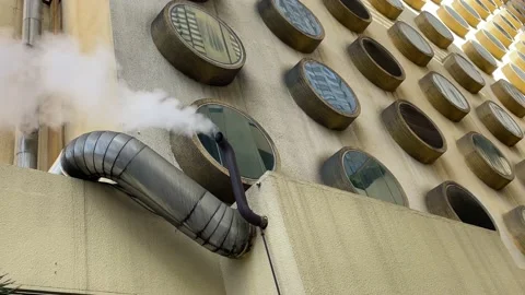 Steam blowing from the pipe on the building 動画素材 219342562