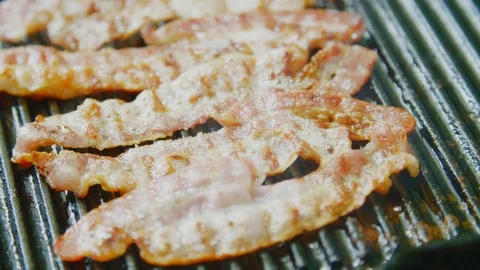 Steam Blowing Through Fresh Bacon On Grill Pan Stock Footage 86070688