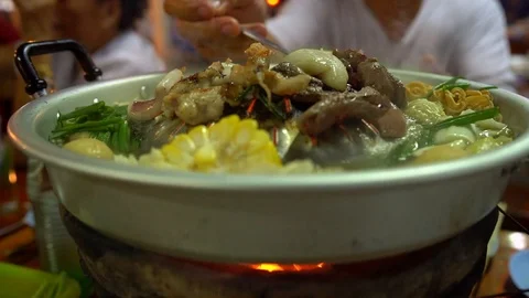 Steam Boat barbaque cooking over hot coals 動画素材 103207331