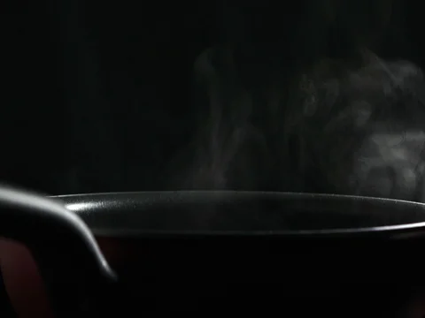 Steam from Boiling water in coating pan Stock Footage 73072624