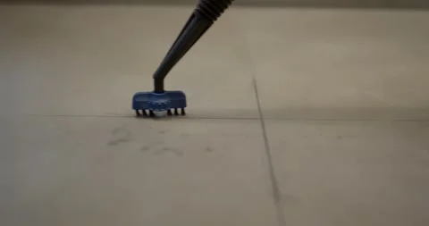 Steam Cleaner Brush Attachment Scrubbing Grout in a Tile Floor Видео 340272759