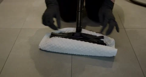 Steam Cleaner Mopping a Bathroom Tile Floor With a White Cloth Video stock 340272166