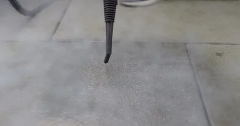 Steam Cleaner Nozzle Tip Releasing Dense Steam On Tile Floor Stock-Footage 340274979