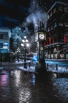 Steam clock in winter evening setting Stock Photos