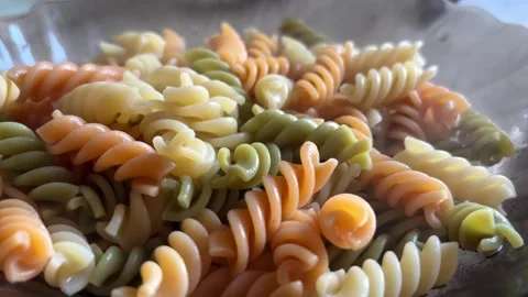 Steam comes from hot Colored pasta. Stock Footage 281465860