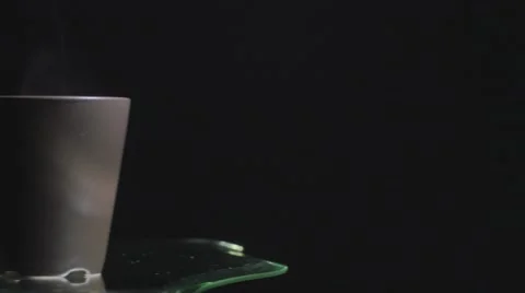 Steam coming from coffee black background pan over 2 Stock Footage 44404472