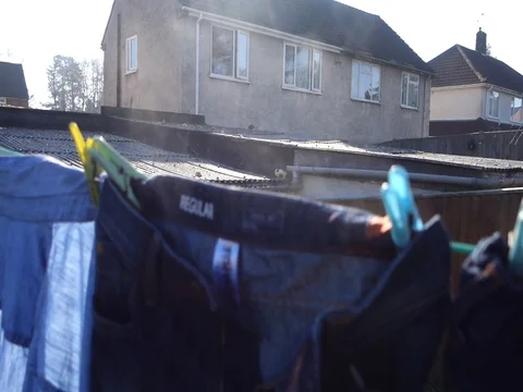 Steam coming form clothes drying on a washing line Stock Footage 104458381