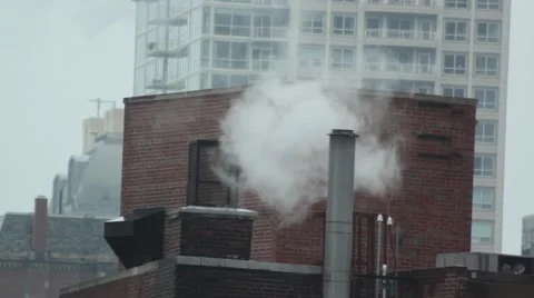Steam Coming out of a Chimney/Smoke Stack on a High rise Rooftop Stock Footage 44827459
