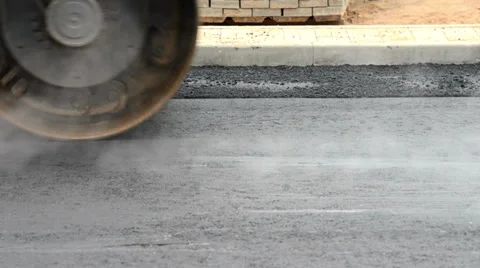 Steam compactor roller at road work Video stock 34638535