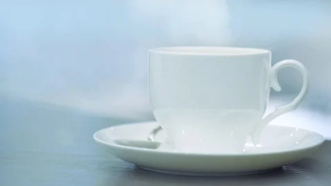 Steam from a cup with a hot coffee . Stock Footage 84161261