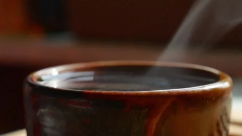 Steam from a cup with hot tea. Video stock 156759646