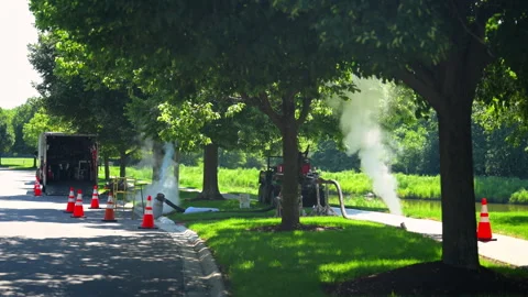 Steam Cured CIPP Trenchless Sewer Pipe Rehabilitation on street Vídeo Stock 346020902