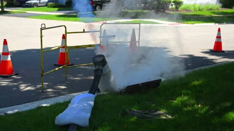 Steam Cured CIPP Trenchless Sewer pipe rehabilitation process with vapor rising Vídeo Stock 346022211