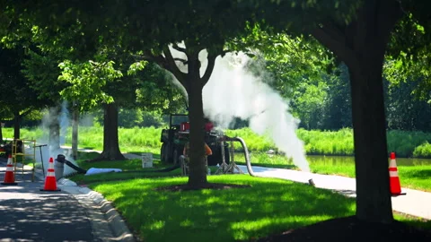 Steam Cured CIPP Trenchless Sewer Pipe Rehabilitation on street at sunny day Vídeo Stock 346791491