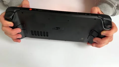 Steam deck handheld console man gaming computer playing video games gamer Видео 324899406