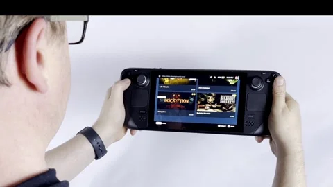 Steam Deck - Over Shoulder Stock Footage 313089569