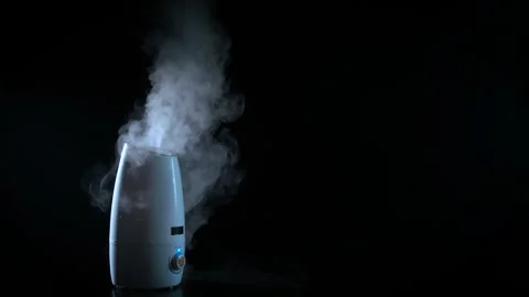 Steam diffuser on table in the dark Stock Footage 308245922
