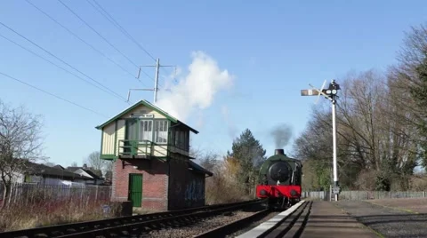  Steam engine arrives at old fashioned British station 動画素材 60753920