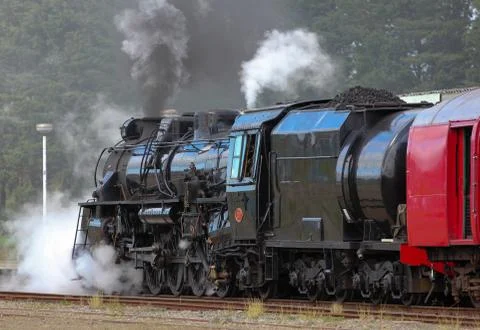 Steam engine leaving station. Fotos de archivo