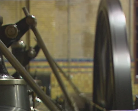 Steam engine in motion, close up + flywheel rotates Stock Footage 107656627