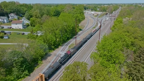 Steam Engine Navigates Through Freight Yard Move Freight Cars Lush Greenery.. Video stock 303388371