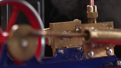 Steam Engine - Pan up from pistons to steam Stock Footage 84065219