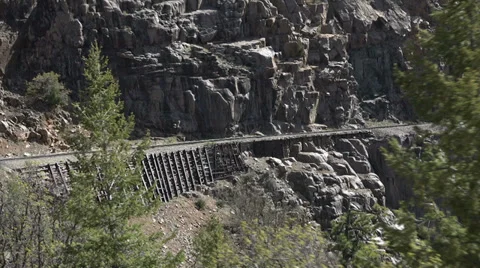 Steam engine railroad tracks steep cliff Colorado Rocky HD 120 Stock Footage 38605405