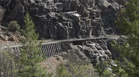 Steam engine railroad tracks steep cliff Colorado Rocky 4K 120 Stock Footage 41466092