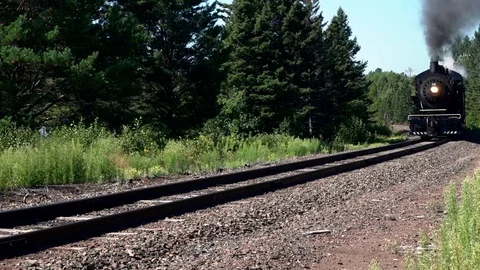 Steam engine rounds the bend Stock Footage 125092345
