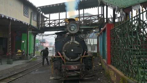 Steam engine Toy train being prepared for journey through Himalayas Stock Footage 259132771