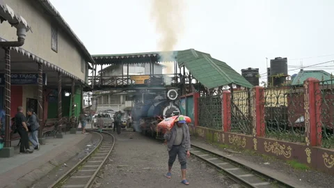 Steam engine Toy train being prepared for journey through Himalayas Stock Footage 259778871