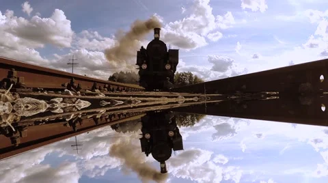 Steam engine train locomotive driving over camera. mirror reflection background Видео 43619044
