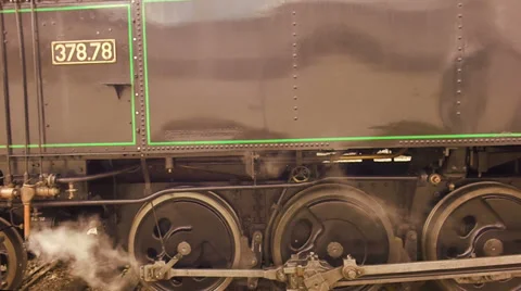 Steam engine. train locomotive. nostalgic. steel wheels. smoke puffing Stock Footage 34534265