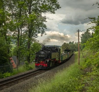 Steam engine train with passengers in fresh summer day near Neudorf Germany 0 Stock Photos
