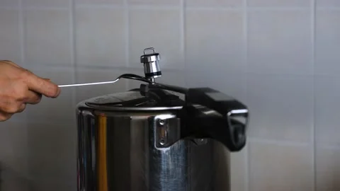 Steam escaping from lid of pressure Stock Video Pond5
