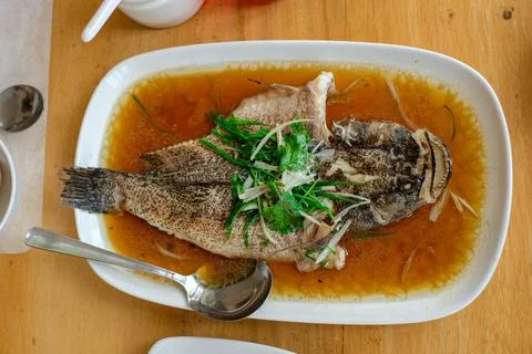 Steam fried Marbled Goby fish called Ikan Malas in siamese style served in .. Stock Photos