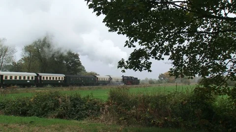 Steam hauled passenger train - off camera - backwards Stock Footage 122824239